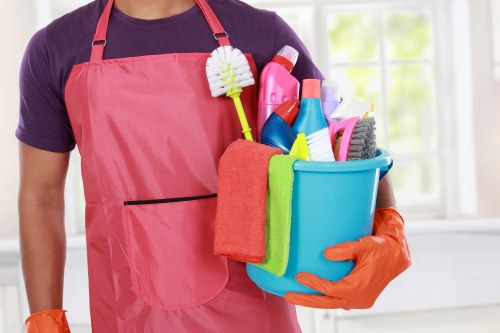 Cleaner preparing equipment under a safety-focused workplace policy