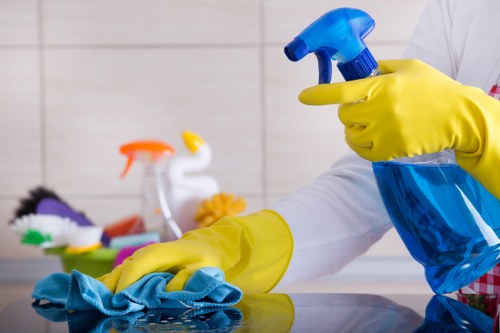 Professional cleaner in Brixton preparing a tidy living room