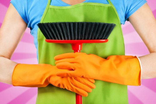 Professional cleaners servicing a modern office in Brixton