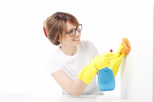 Staff member reviewing cleaning procedures and hazard controls